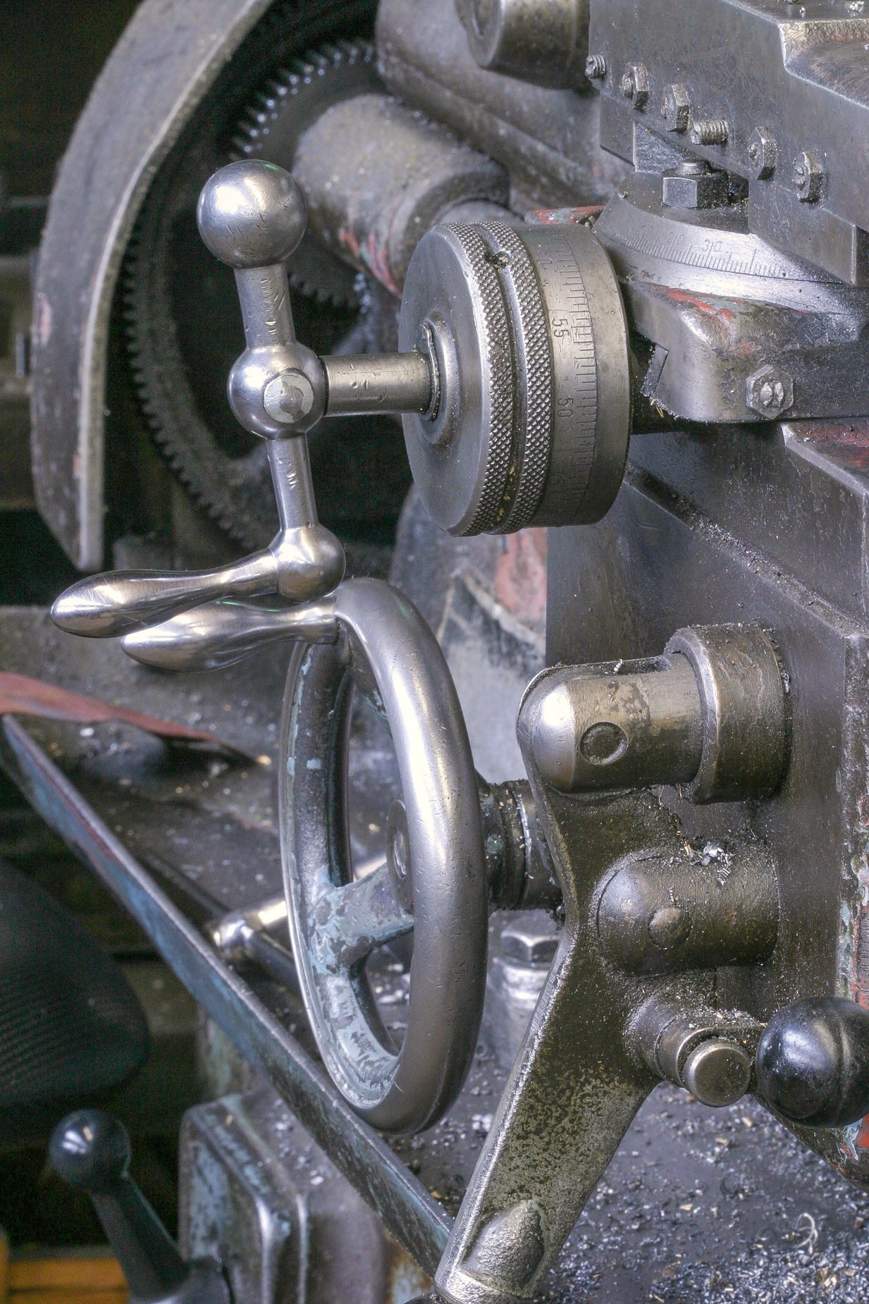 The linkage and levers of a shop press in close-up
